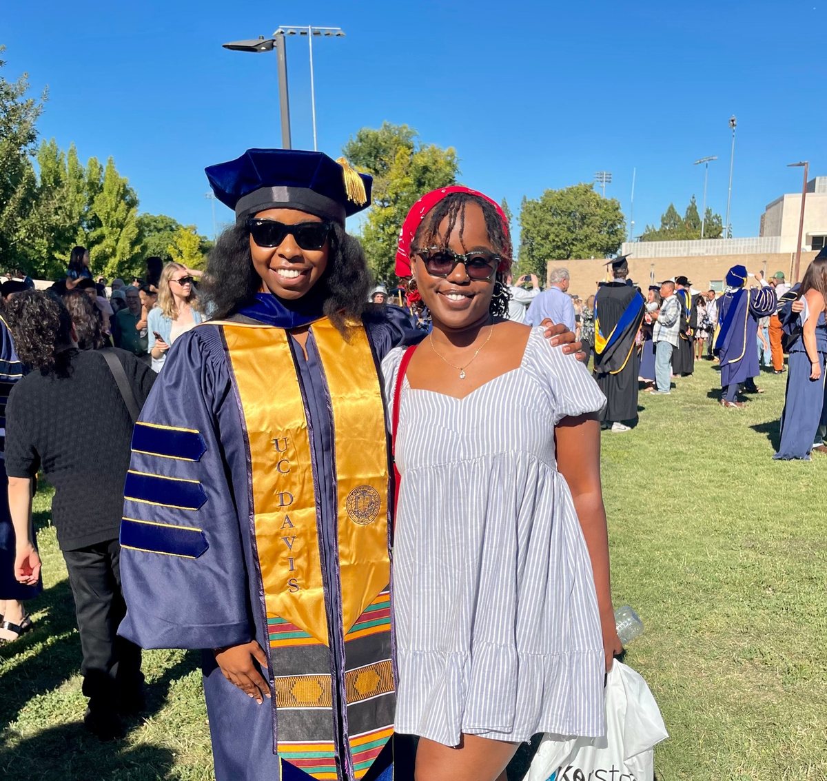 Cynthia with a friend at her doctoral hooding ceremony at UC Davis